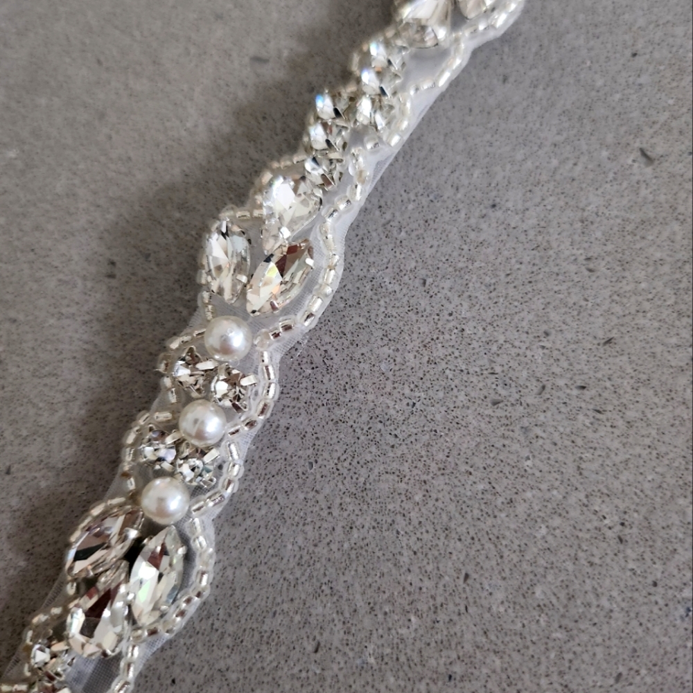 Beautiful thin belt with rhinestones and pearls and white ribbon.